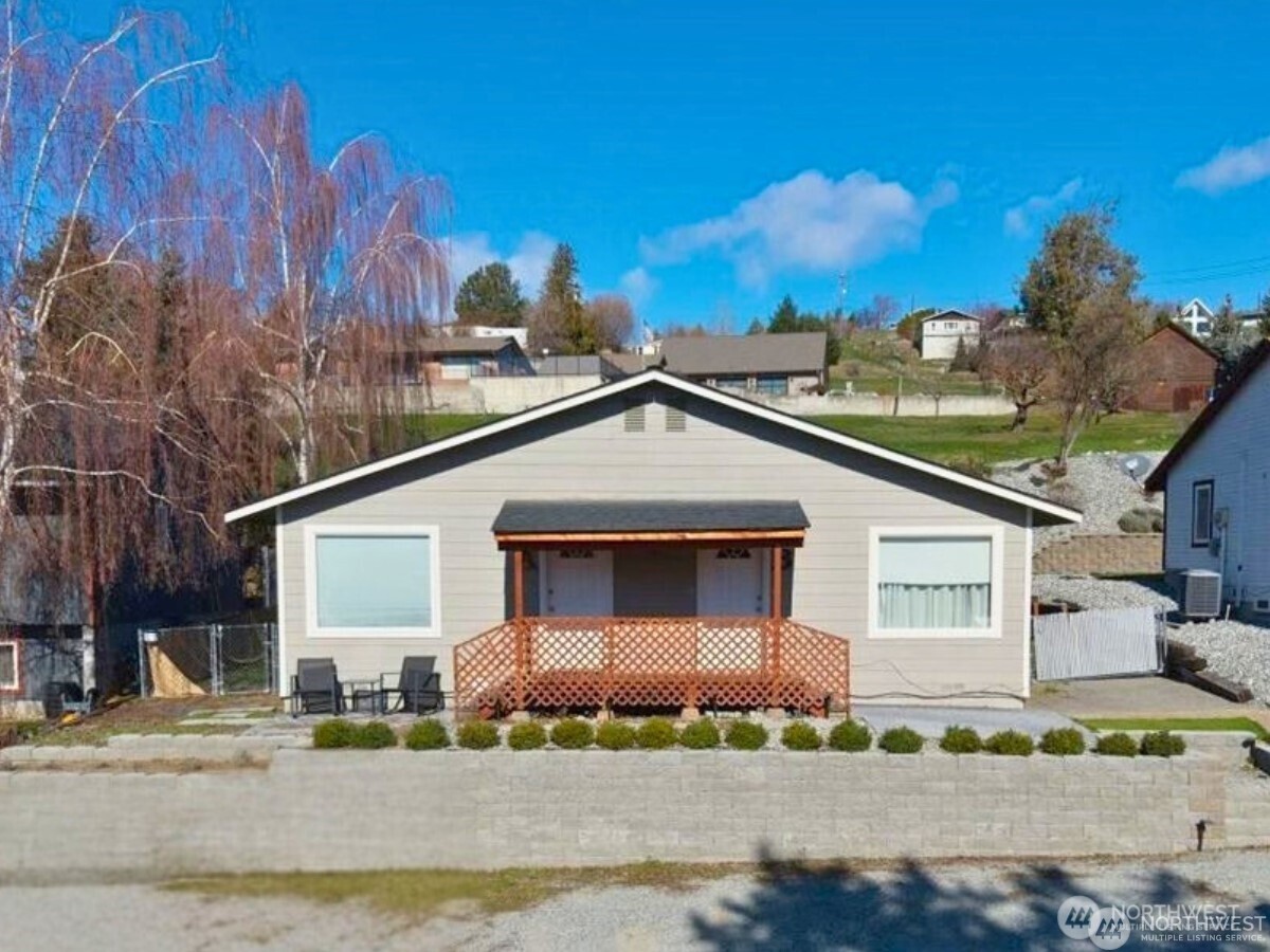 380 North Shore Court Manson, WA 98831 - Photo 22 of 27 a front view of a house with a yard