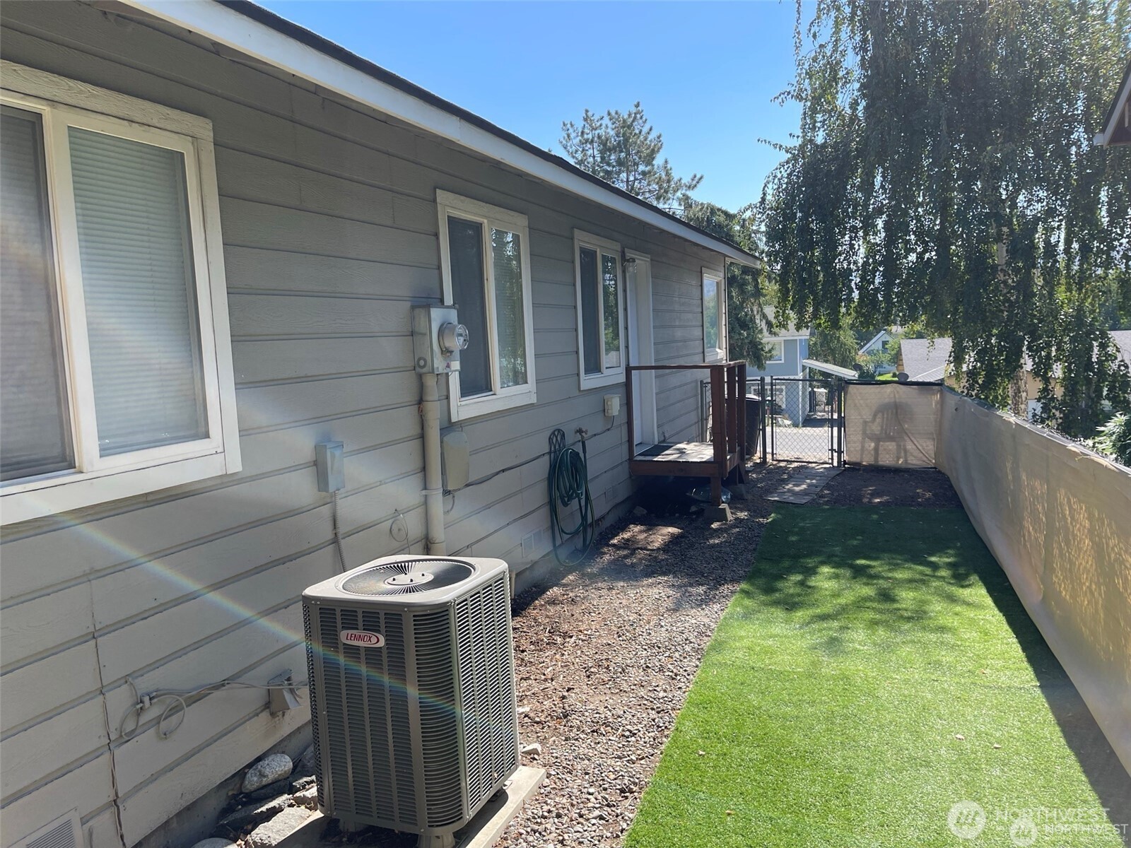 380 North Shore Court Manson, WA 98831 - Photo 23 of 27 a backyard of a house with fountain table and chairs