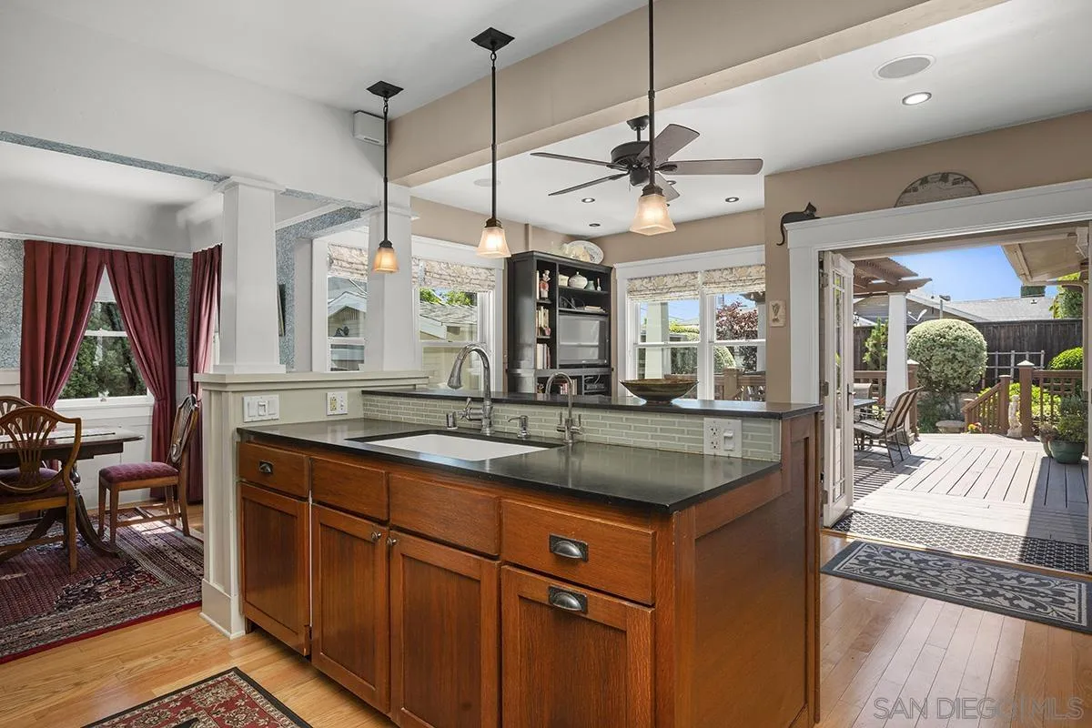 3636 Herbert Street San Diego, CA 92103 - Photo 24 of 55 a kitchen with stainless steel appliances granite countertop a sink and a stove