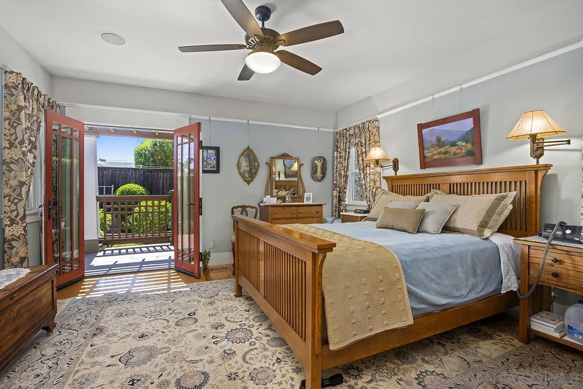 3636 Herbert Street San Diego, CA 92103 - Photo 31 of 55 a bedroom with a bed and a chandelier