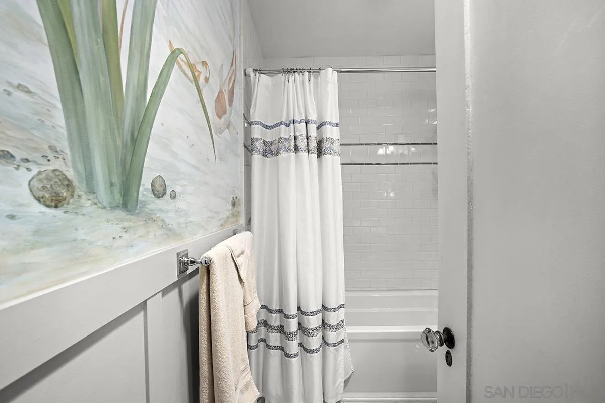 3636 Herbert Street San Diego, CA 92103 - Photo 40 of 55 a bathroom with a mirror and a shower