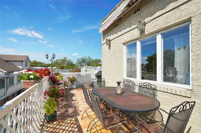 a view of a chairs and table in a patio