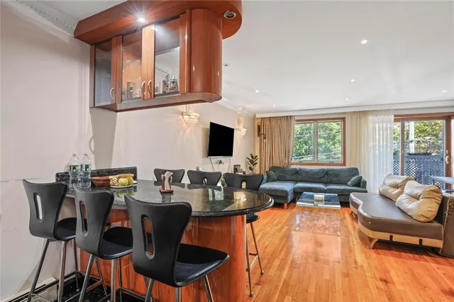 a living room with fireplace furniture and a flat screen tv