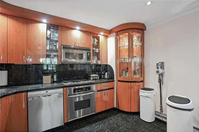 a kitchen with a stove and a sink