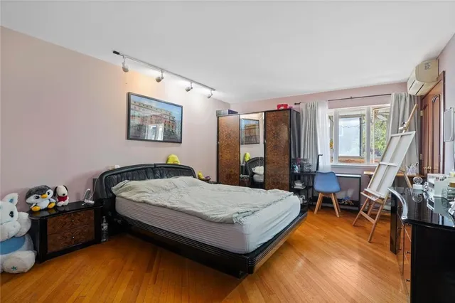 a bedroom with a bed and a table in it