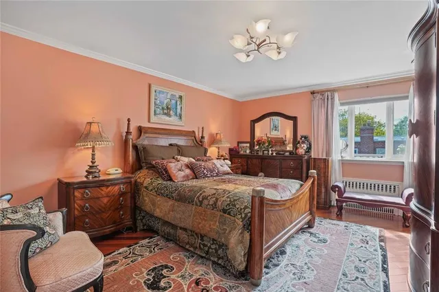 a bed room with a bed and a chandelier