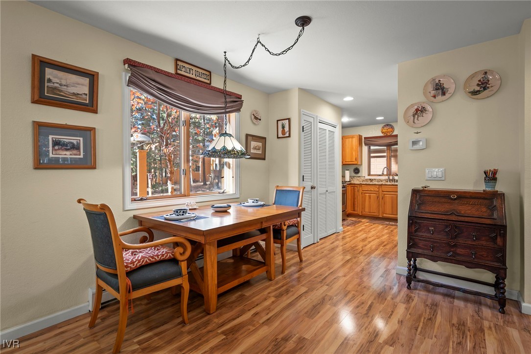 939 Incline Way, Unit 221 Incline Village, NV 89451 - Photo 11 of 20 a room with a wooden table and chairs
