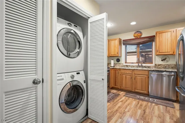 a bathroom with a sink a washer and dryer