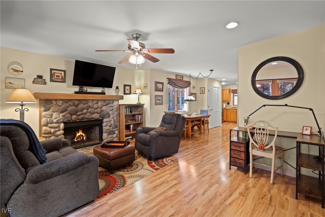 939 Incline Way, Unit 221 Incline Village, NV 89451 - Photo 8 of 20 a living room with furniture a flat screen tv and a fireplace