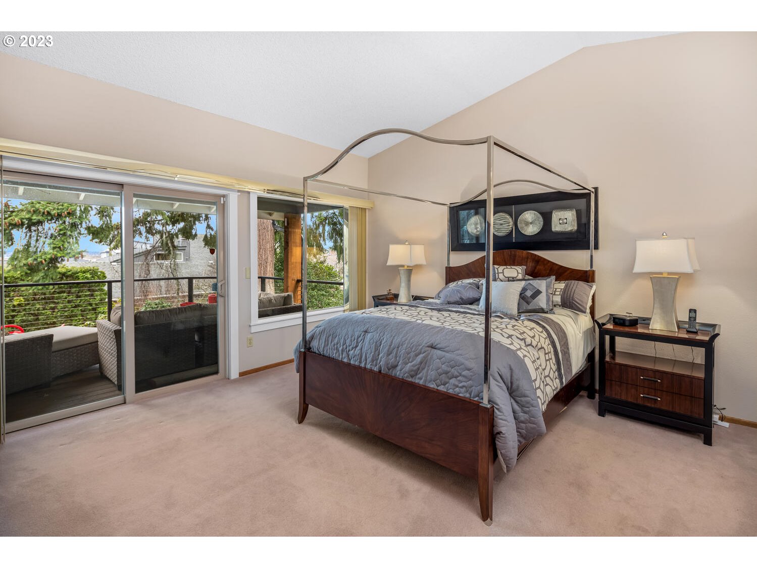 822 Southeast Morgan Road Vancouver, WA 98664 - Photo 13 of 32 a bedroom with a bed a mirror and a large window