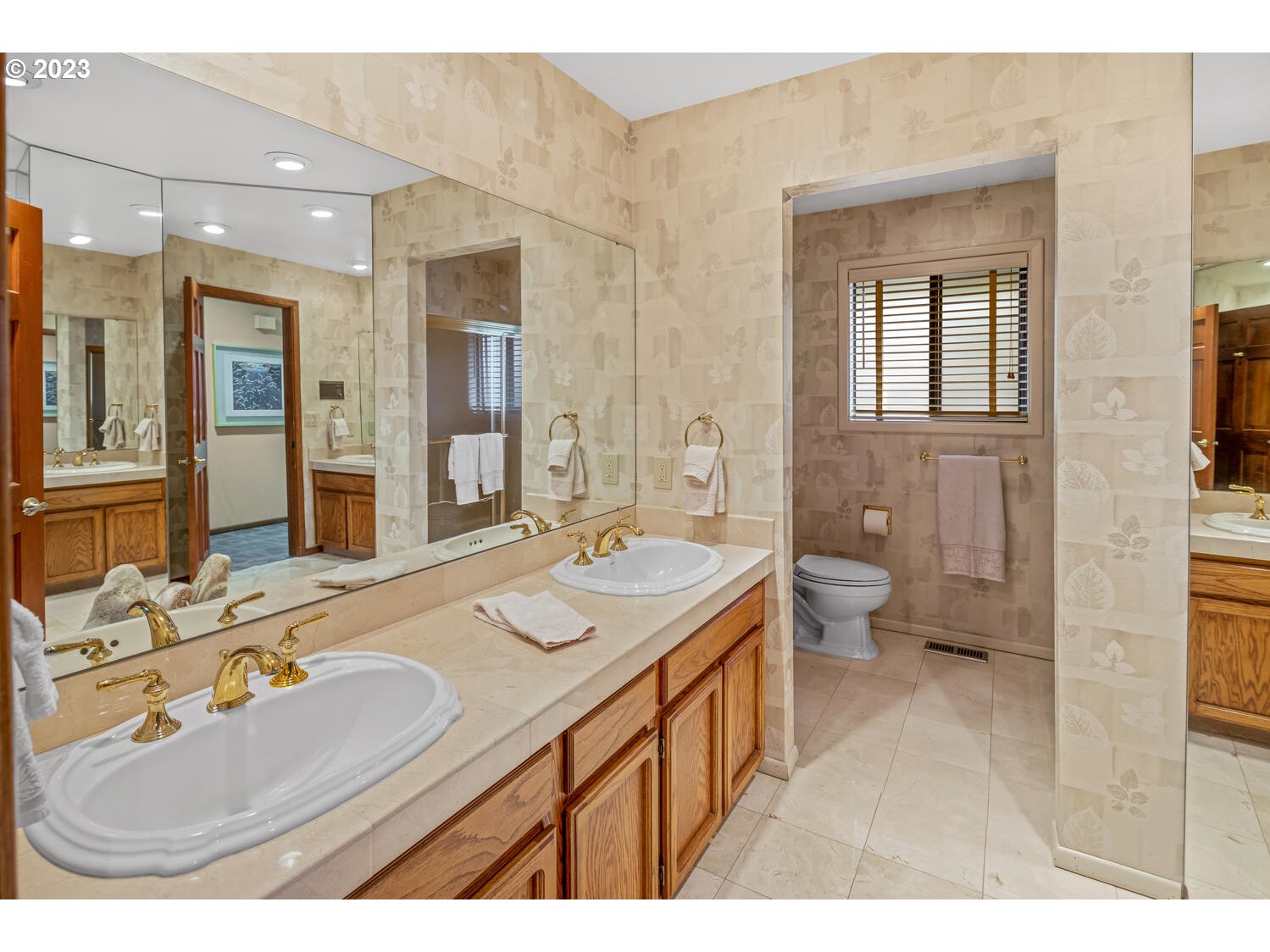 822 Southeast Morgan Road Vancouver, WA 98664 - Photo 18 of 32 a bathroom with a sink double vanity and a mirror