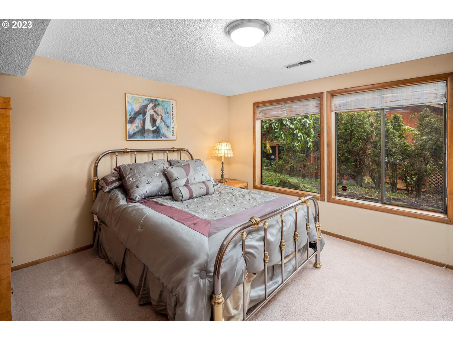 822 Southeast Morgan Road Vancouver, WA 98664 - Photo 23 of 32 a bedroom with a bed a large window with outer view and couch