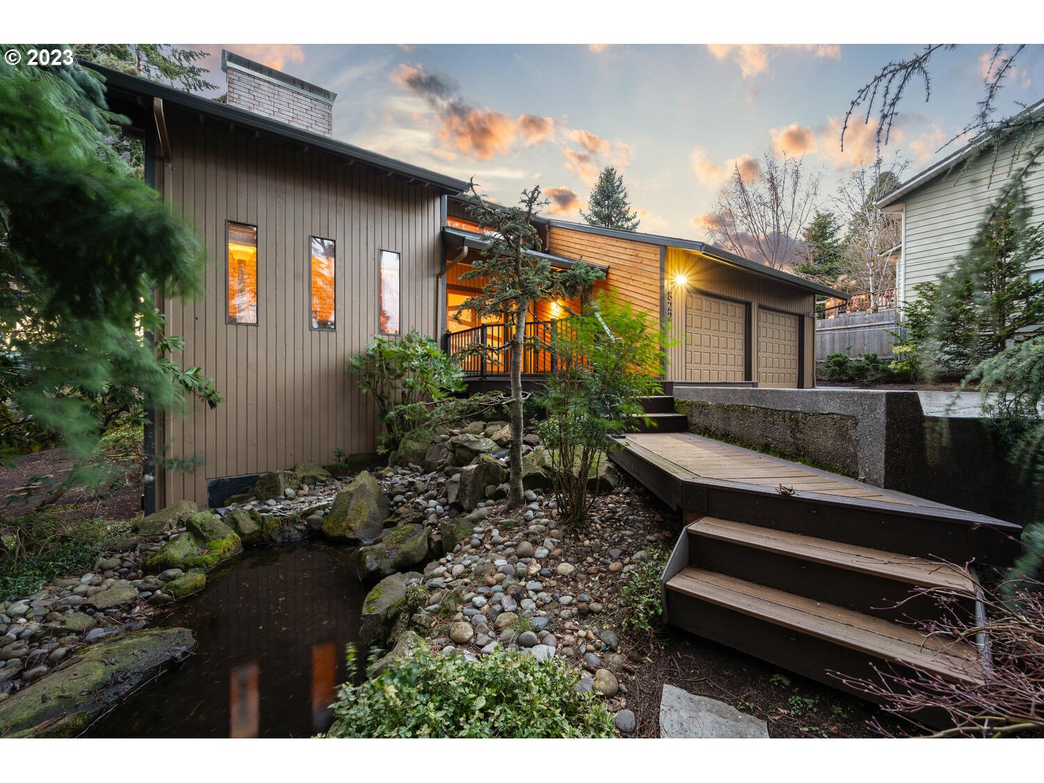 822 Southeast Morgan Road Vancouver, WA 98664 - Photo 28 of 32 a backyard of a house with large trees and outdoor seating