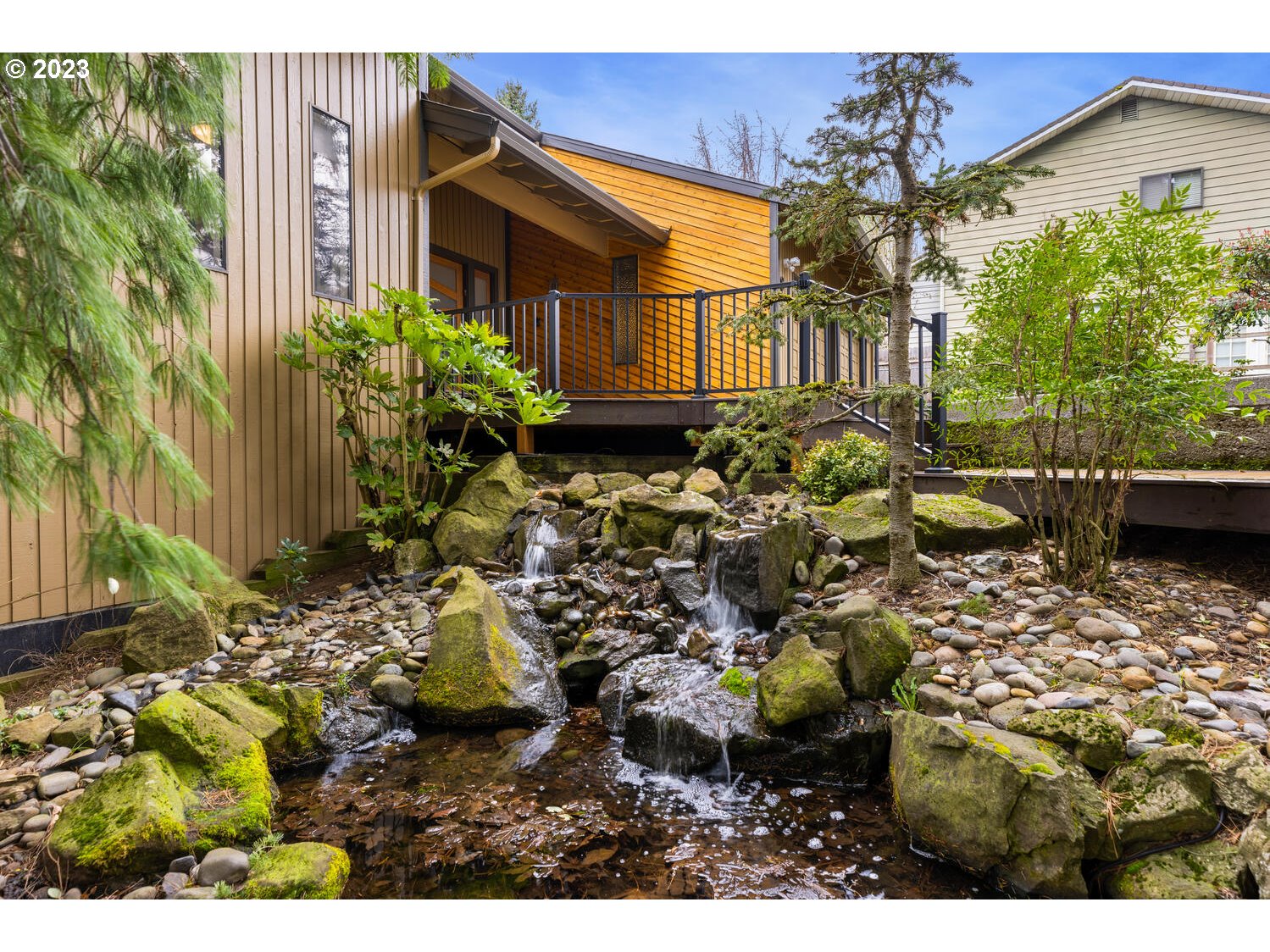 822 Southeast Morgan Road Vancouver, WA 98664 - Photo 29 of 32 a view of a house with a flower garden