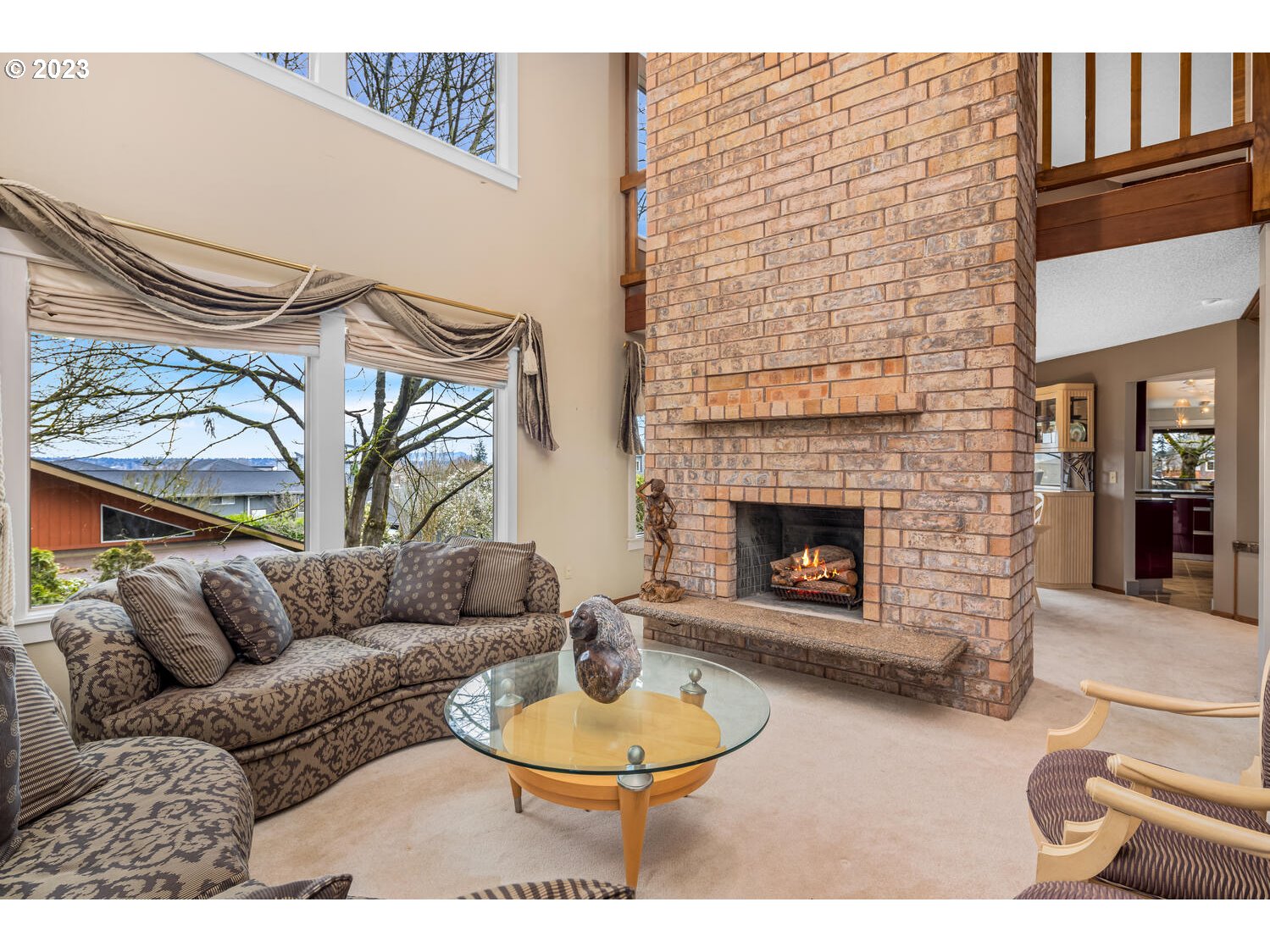 822 Southeast Morgan Road Vancouver, WA 98664 - Photo 5 of 32 a living room with furniture a fireplace and a large window