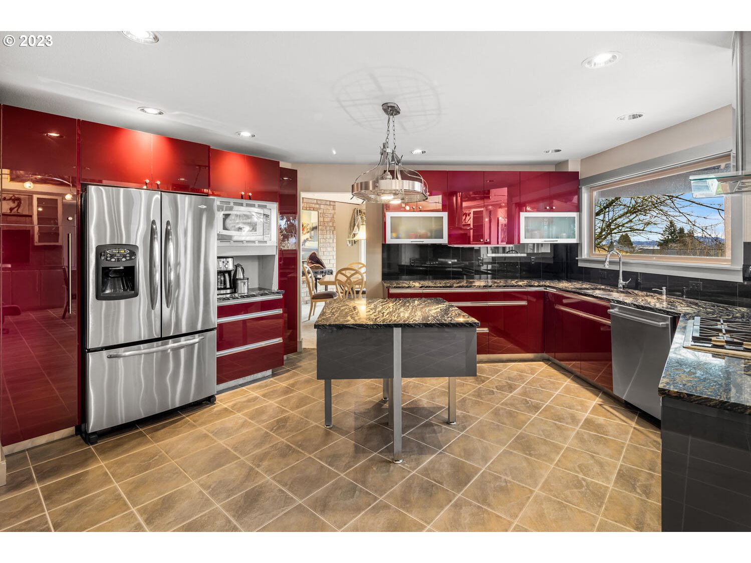 822 Southeast Morgan Road Vancouver, WA 98664 - Photo 9 of 32 a kitchen with stainless steel appliances kitchen island granite countertop a sink and cabinets