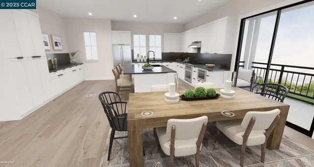 a kitchen with stainless steel appliances kitchen island granite countertop a dining table chairs and white cabinets