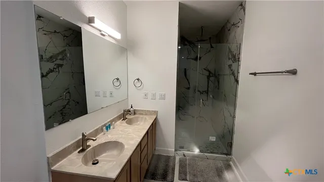 a living room with furniture and a rug