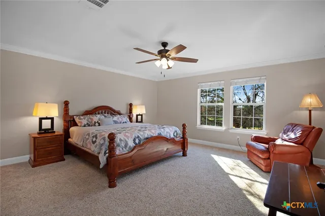 a white toilet sitting next to a shower and a sink