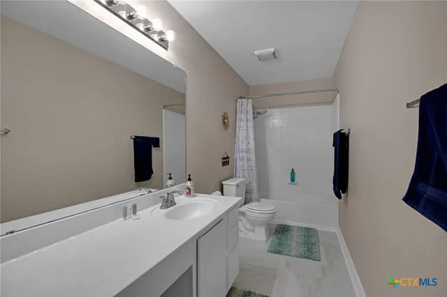 a bedroom with a large bed and a large window