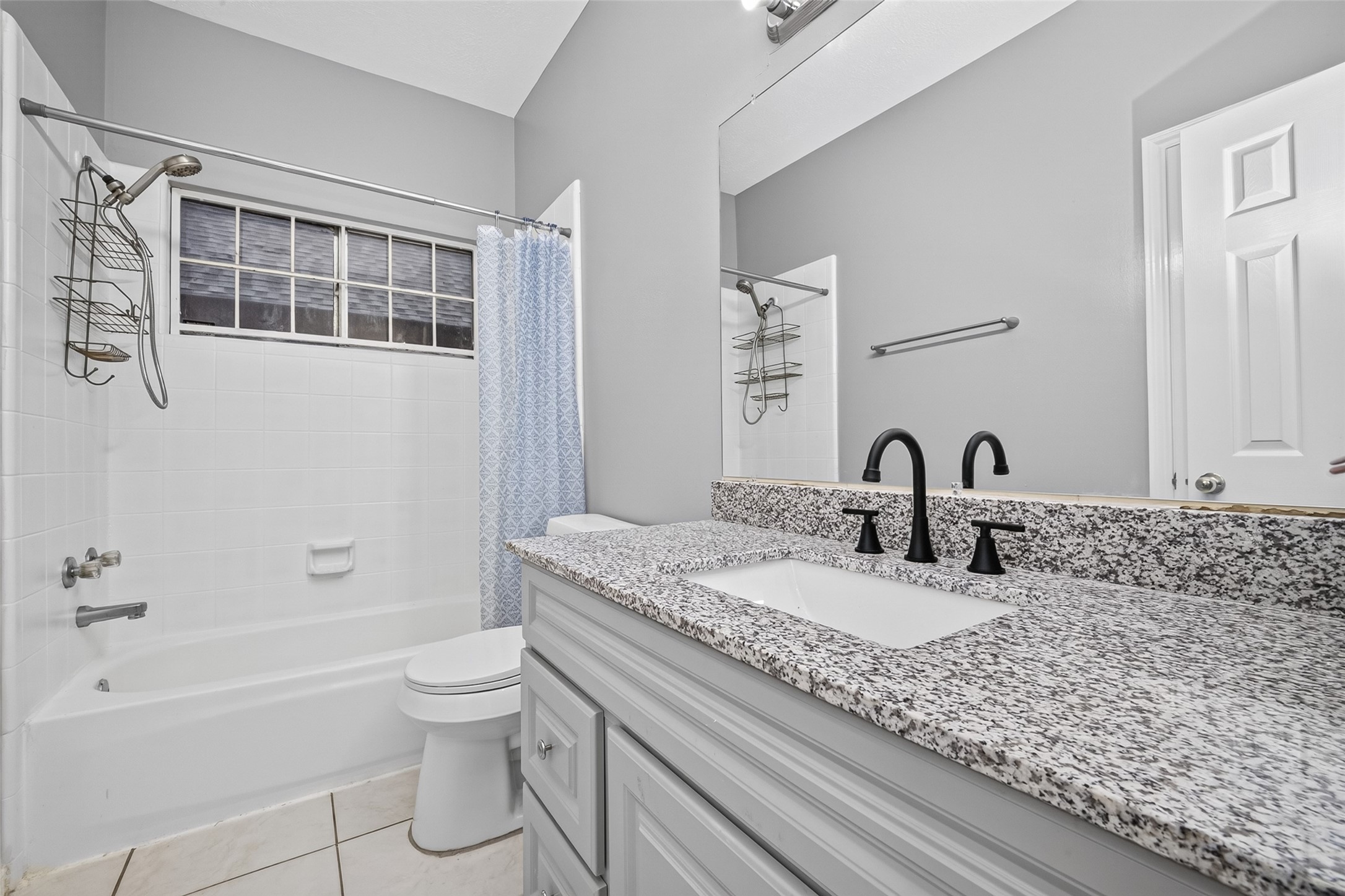 13607 Sable Lane Houston, TX 77014 - Photo 35 of 46 a bathroom with a granite countertop toilet a sink and bathtub