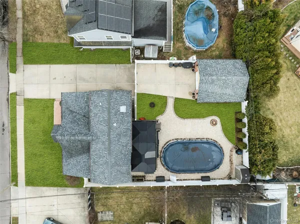 an aerial view of a house with a swimming pool