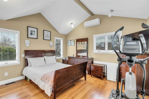 a bedroom with furniture and a window