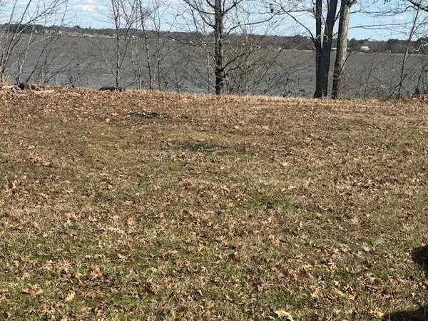a view of snow in middle of yard
