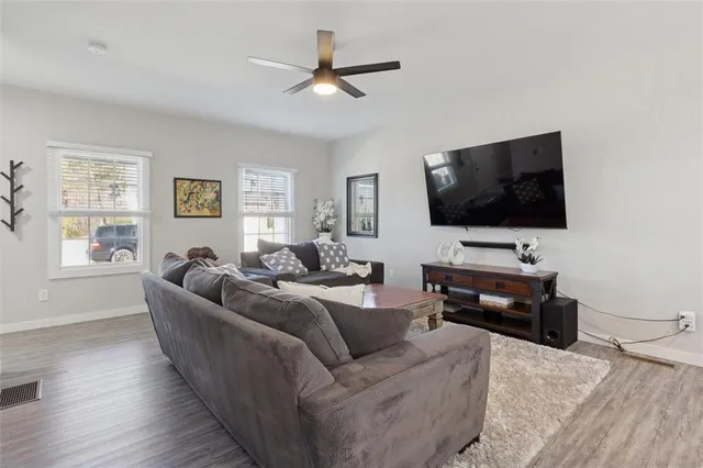 a living room with furniture and a rug