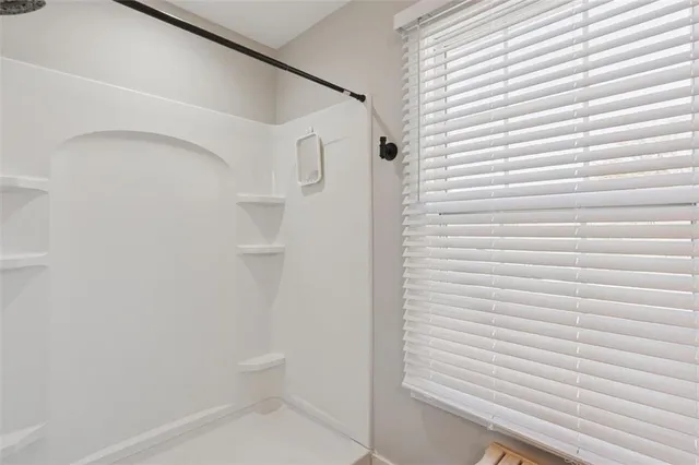 a kitchen with cabinets and window