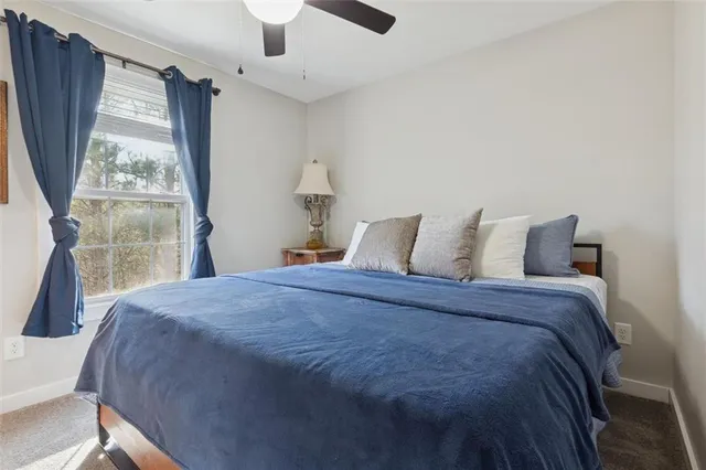 a view of a hallway with wooden floor and closet
