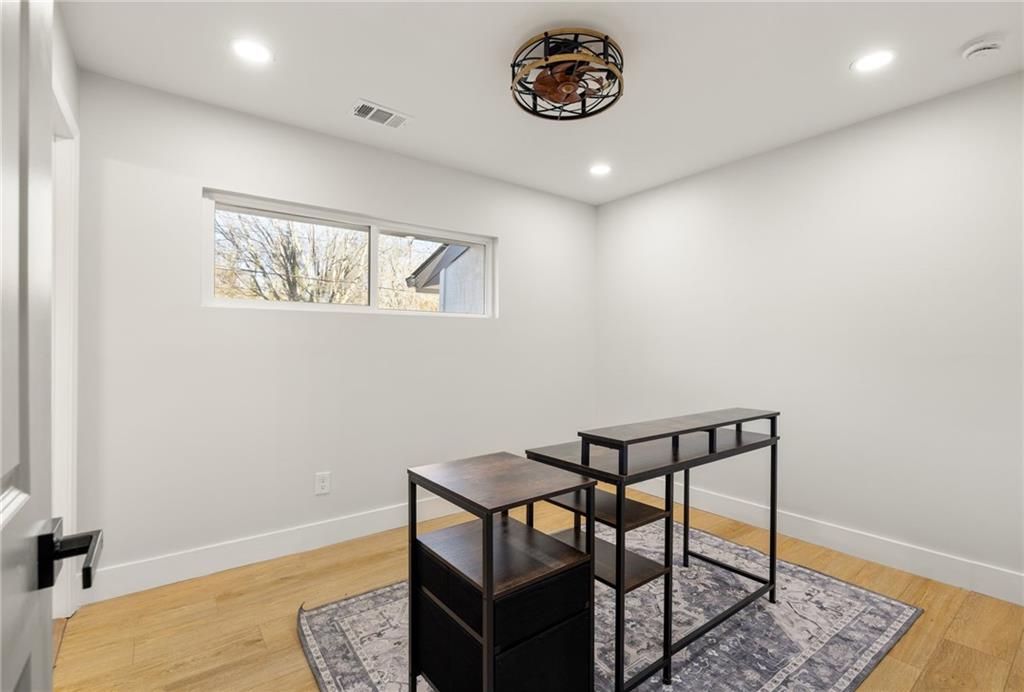 2633 Yale Terrace Decatur, GA 30032 - Photo 17 of 21 a view of a hallway that has a table and a chair in it