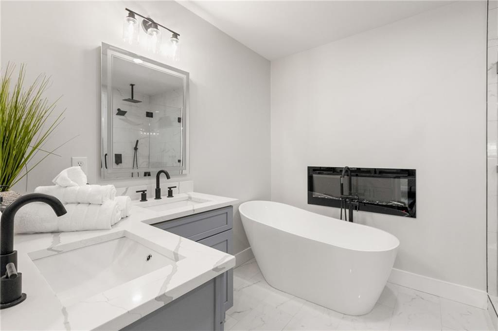 2633 Yale Terrace Decatur, GA 30032 - Photo 5 of 21 a bathroom with a sink a mirror and a bathtub