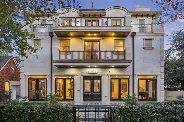 front view of a house with a tree