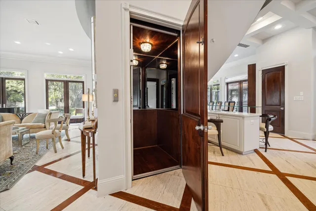 a spacious bedroom with a bed and wooden floor