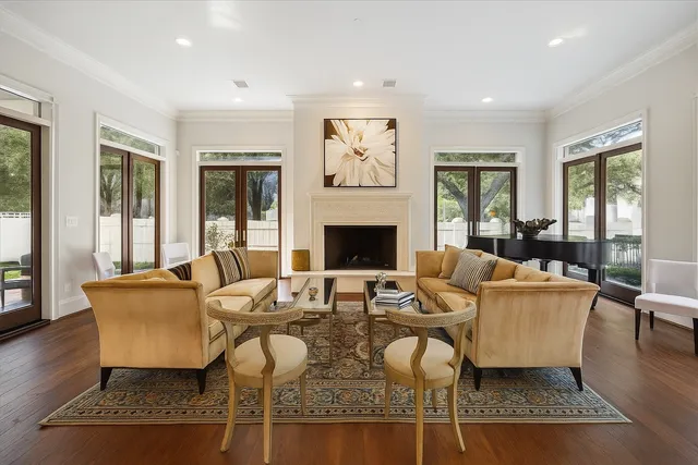 a living room with furniture fireplace and rug