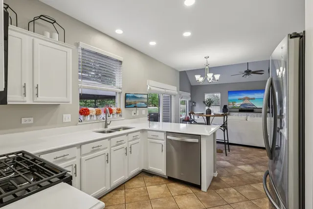 a kitchen with a sink stove and cabinets