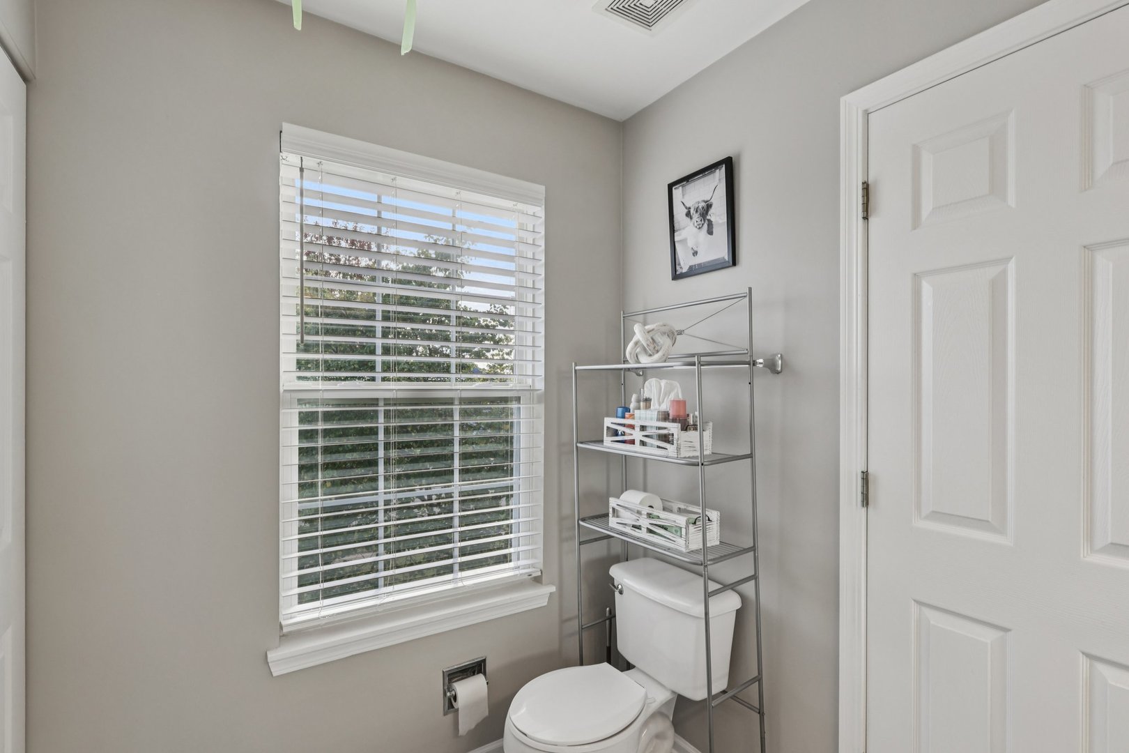 11680 Cape Cod Lane Huntley, IL 60142 - Photo 18 of 47 a bathroom with a toilet a sink and a window