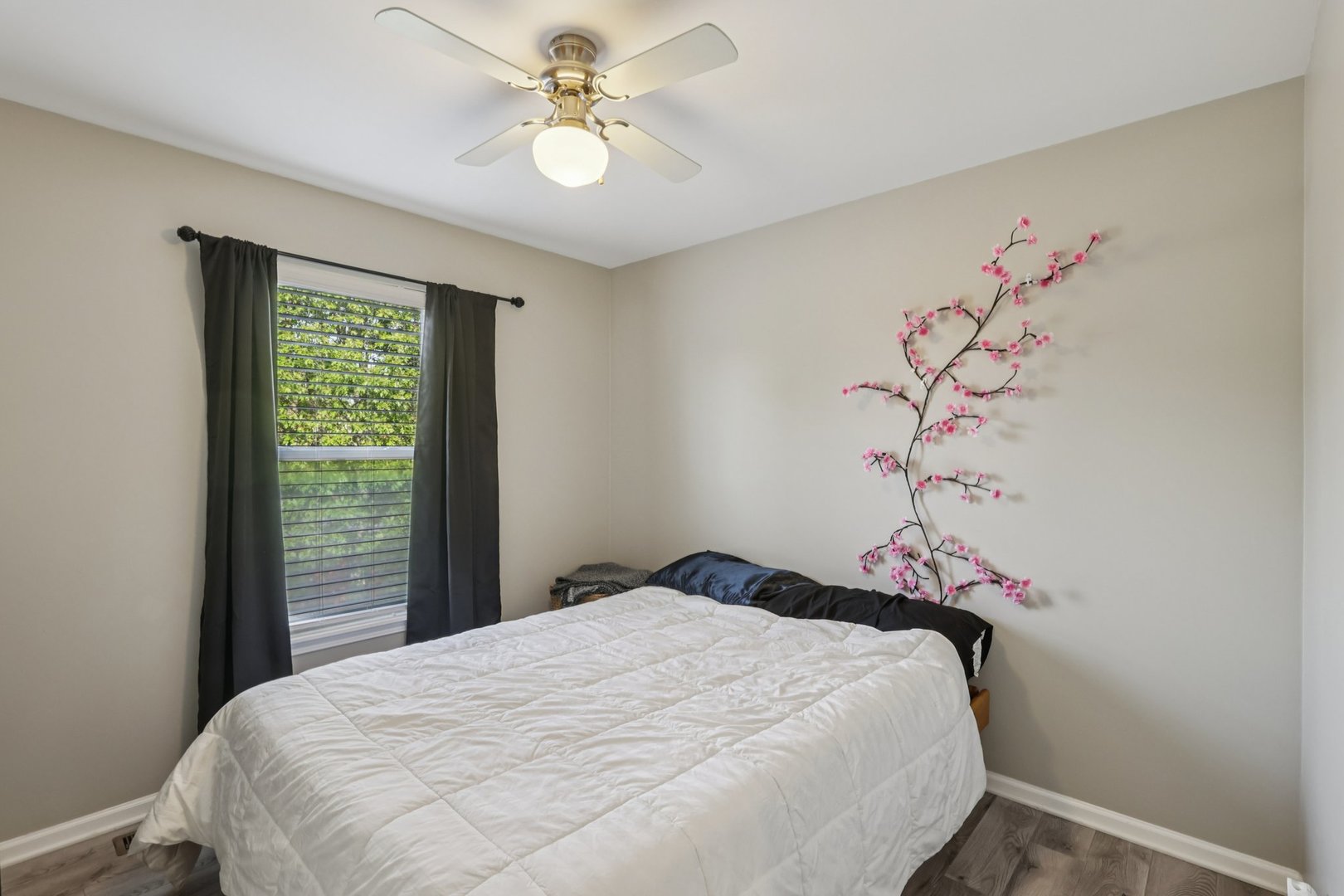 11680 Cape Cod Lane Huntley, IL 60142 - Photo 22 of 47 a bedroom with a bed and a chandelier