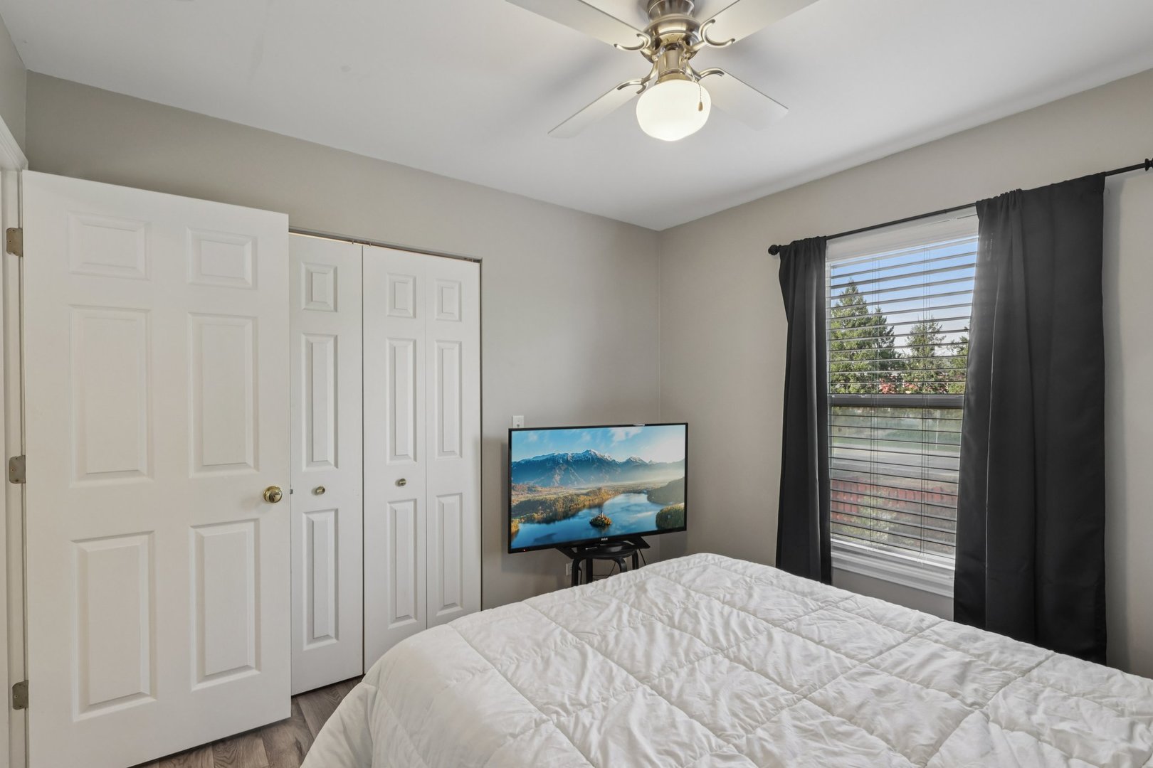 11680 Cape Cod Lane Huntley, IL 60142 - Photo 23 of 47 a bedroom with a bed and a chandelier