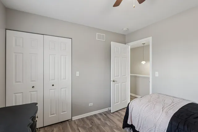 a bedroom with a bed and hallway