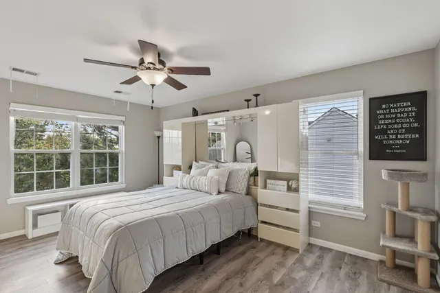 a bedroom with a large bed and a window