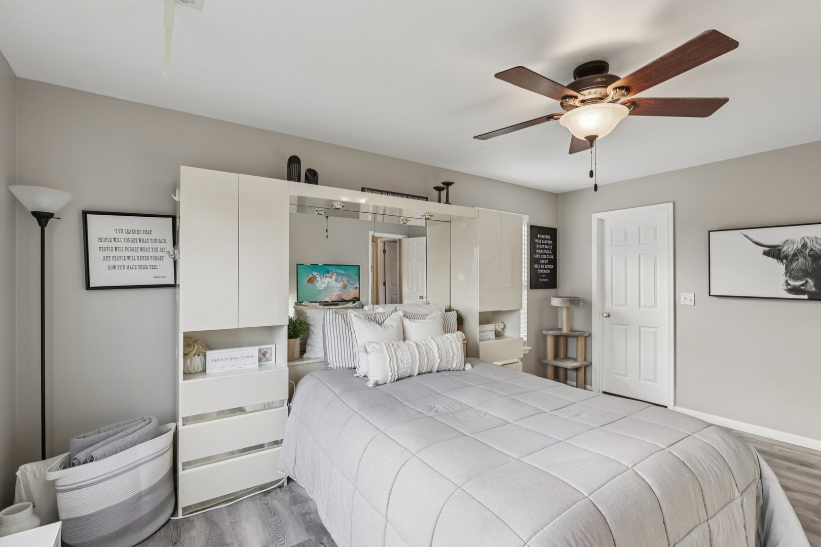 11680 Cape Cod Lane Huntley, IL 60142 - Photo 28 of 47 a bedroom with a bed and a chandelier