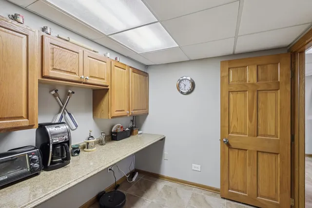 a view of a workspace with furniture