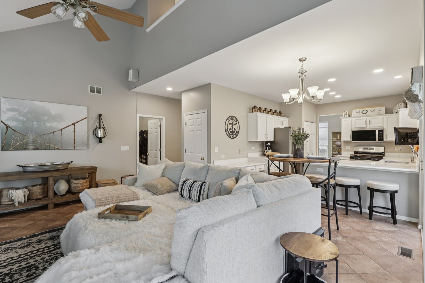 11680 Cape Cod Lane Huntley, IL 60142 - Photo 4 of 47 a living room with furniture and a chandelier