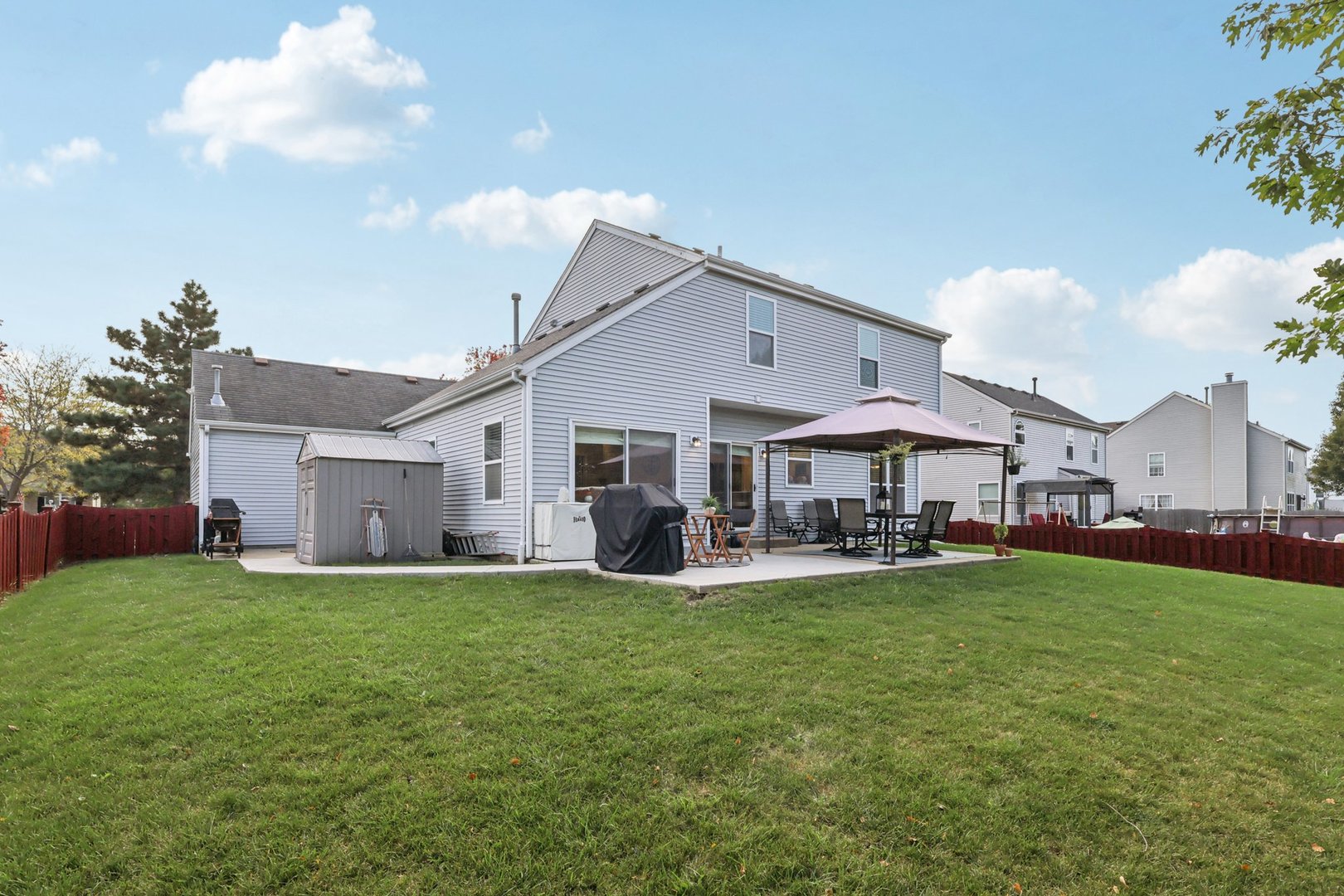 11680 Cape Cod Lane Huntley, IL 60142 - Photo 44 of 47 a view of a house with a yard and sitting area