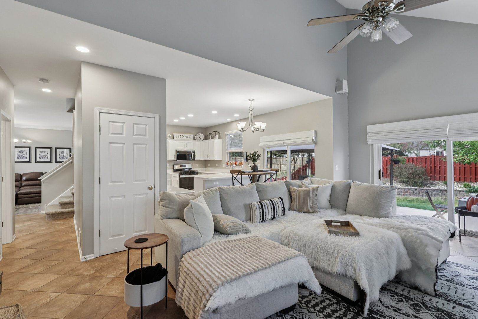 11680 Cape Cod Lane Huntley, IL 60142 - Photo 6 of 47 a living room with furniture and a view of kitchen