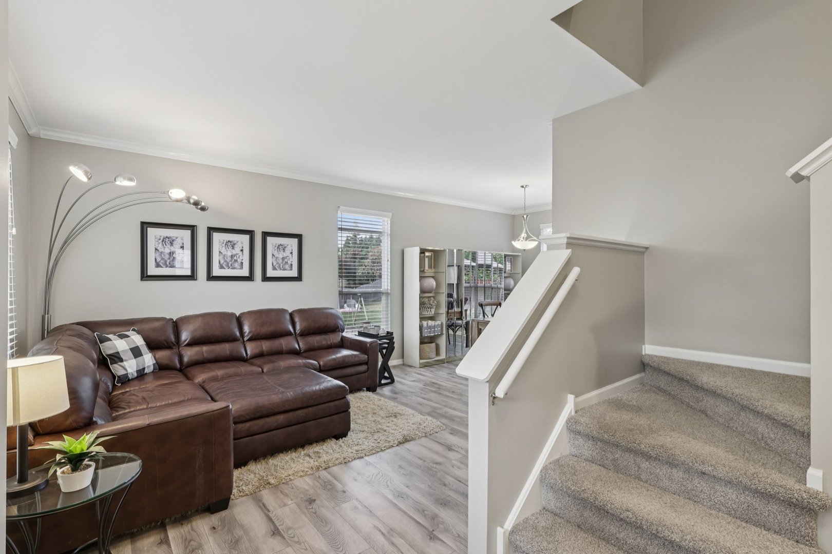 11680 Cape Cod Lane Huntley, IL 60142 - Photo 7 of 47 a living room with furniture and stairs