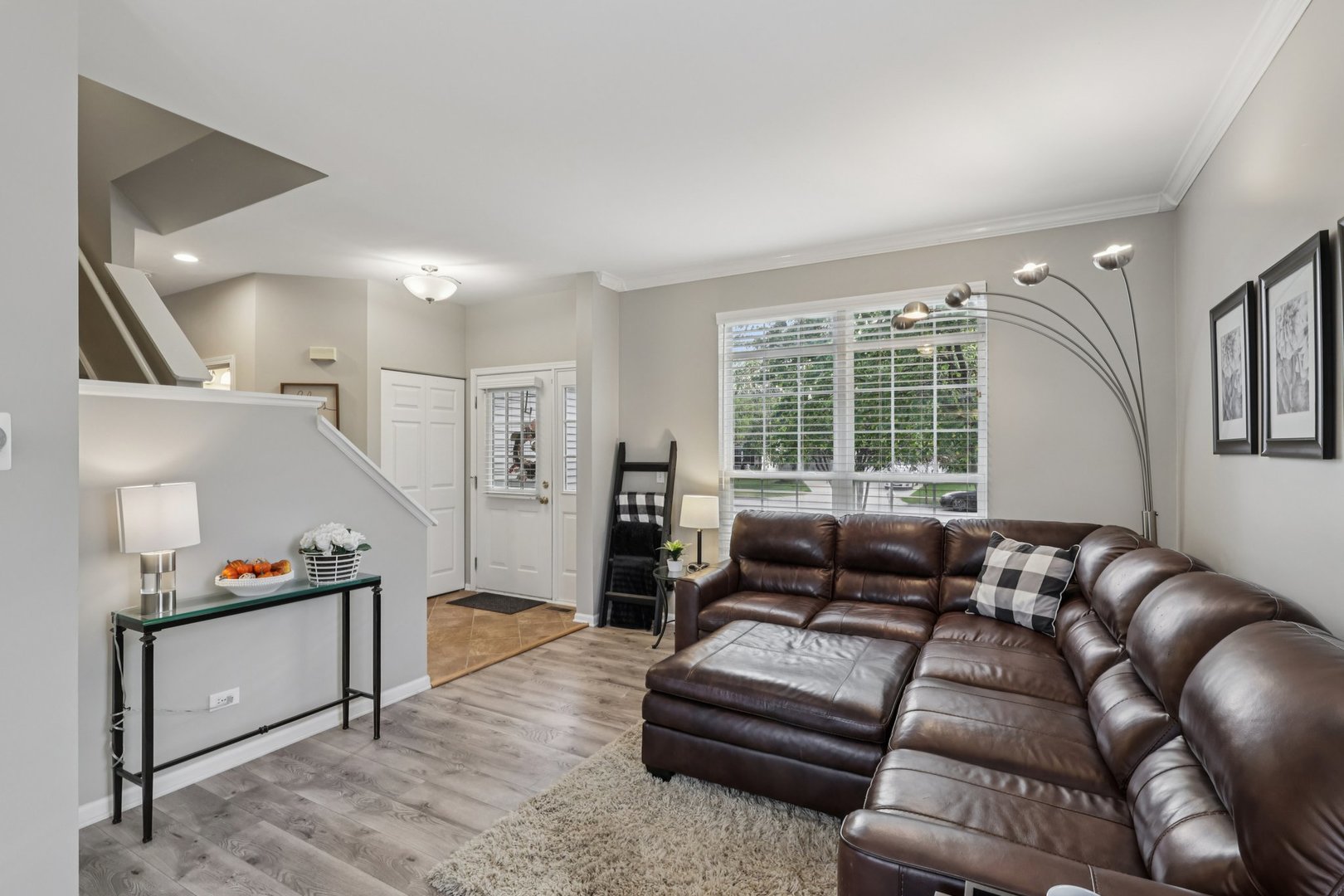 11680 Cape Cod Lane Huntley, IL 60142 - Photo 9 of 47 a living room with furniture and a large window