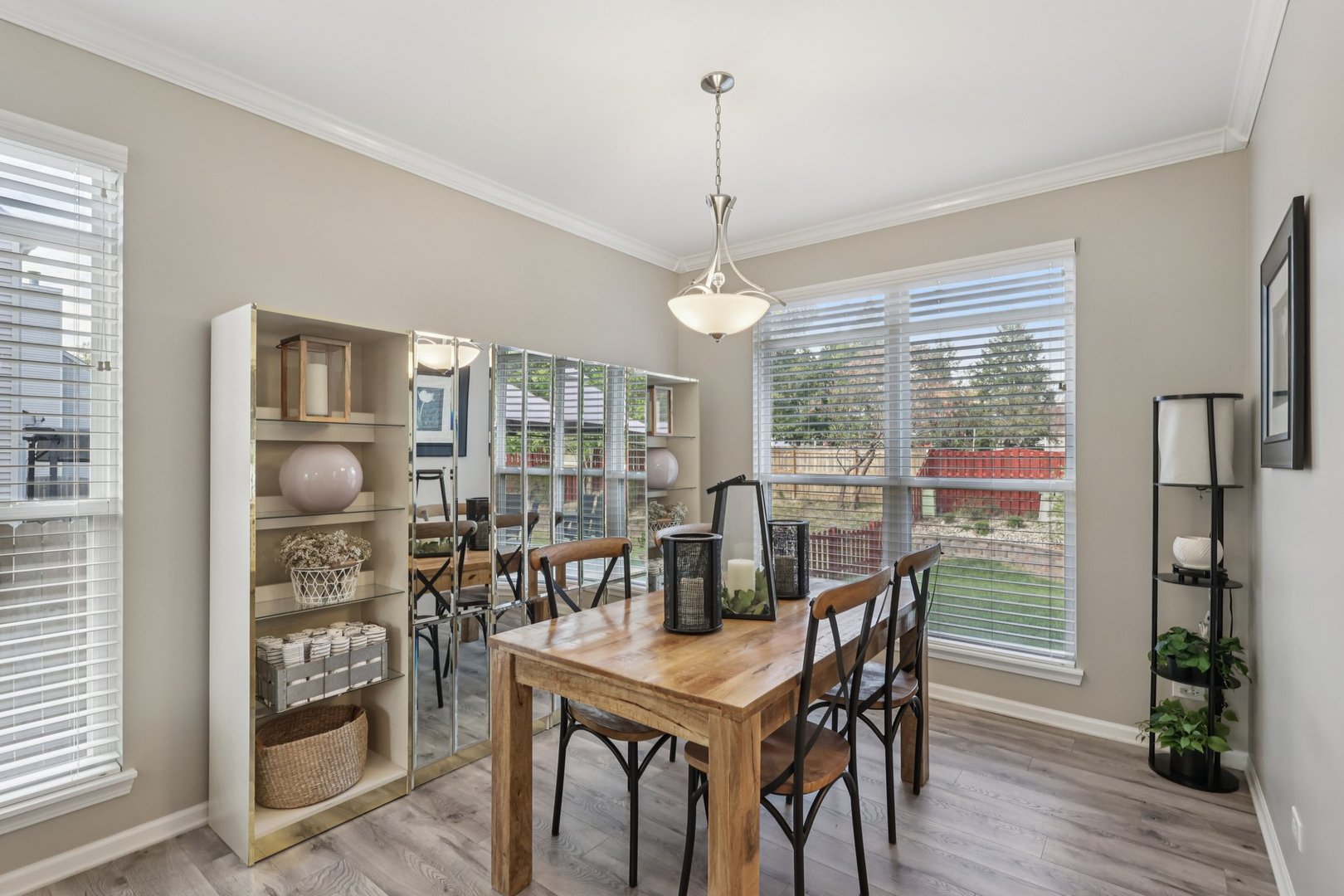 11680 Cape Cod Lane Huntley, IL 60142 - Photo 10 of 47 a view of a dining room with furniture window and wooden floor